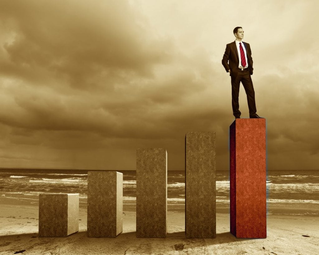 Business person on a graph, representing success and growth