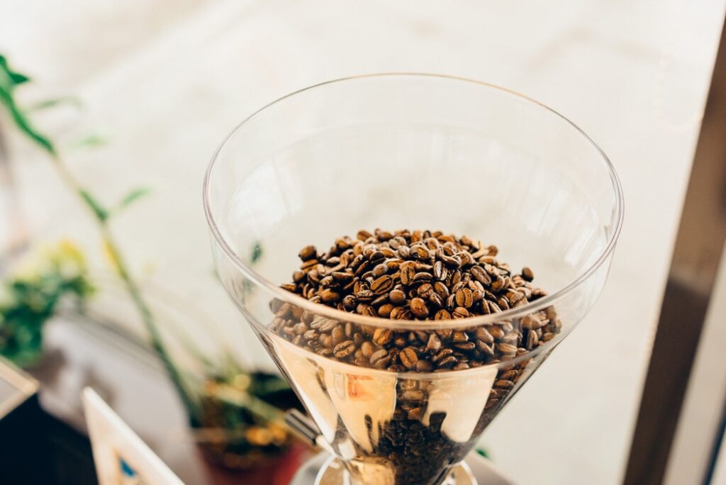 coffee beans in a funnel to represent how to generate leads from LinkedIn